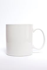 White ceramic mug isolated on white background