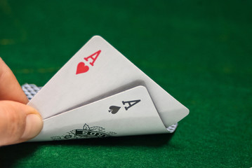 aces pair on a gambling table with chips 