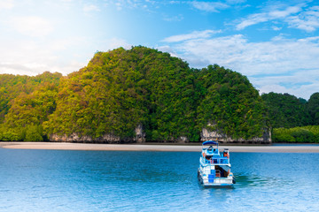 Plakat Tourist cruise boat on the Andaman Sea move on island in Krabi Provine , Thailand.