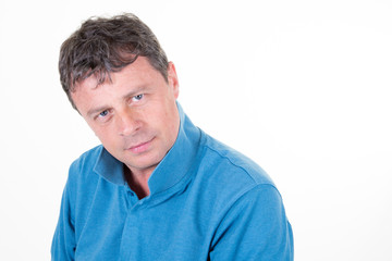 Middle aged man portrait of a mature serious businessman isolated against white background looking at camera with copy space
