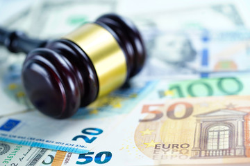 Judge hammer on Euro and US dollar banknotes