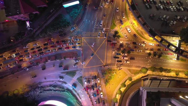 night illuminated kuala lumpur city downtown famous traffic crossroad aerial topdown panorama 4k malaysia