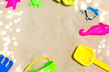 childhood and summer concept - close up of sand toys kit on beach