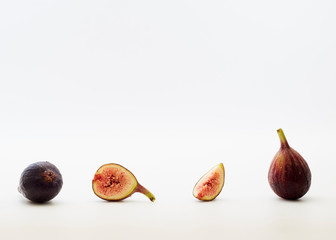 sliced fresh figs on white background