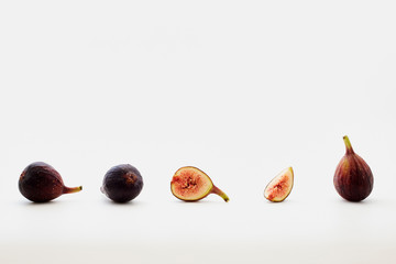 sliced fresh figs on white background