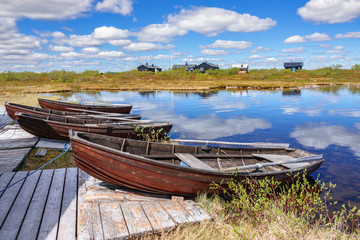 Rowing boats on a jetty by a lake