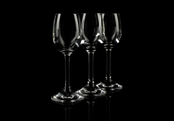 Set of empty glasses on black background