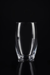 New empty tall glass on black background