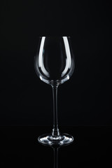 New empty wine glass on black background