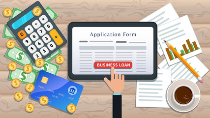 Online business loan or lending concept. Home mortgage. Flat tablet with loan application form and hand click button on desk with cash, calculator, credit card, pencil, cup of coffee, chart.