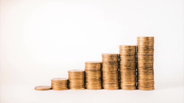 isolated macro step gold coin graph shows rising income