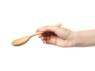Woman holding clean wooden spoon on white background, closeup