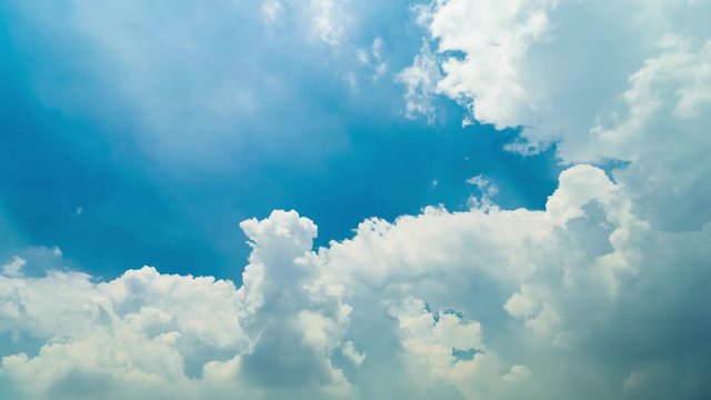 4K Tima lapse white clouds in blue sky