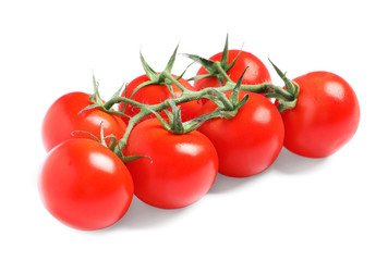 Branch of fresh cherry tomatoes isolated on white
