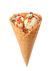 Delicious ice cream in waffle cone on white background