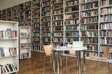 View of bookshelves and table in library