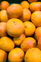 fresh juicy grapefruit on the counter of the supermarket