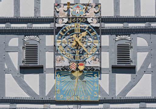 historic town hall clock at the market square in the old town of butzbach germany