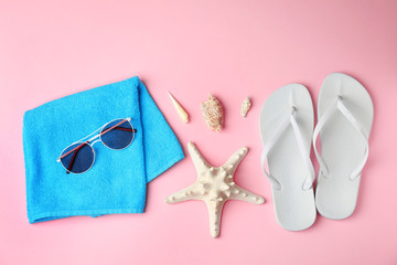 Flat lay composition with different beach objects on color background