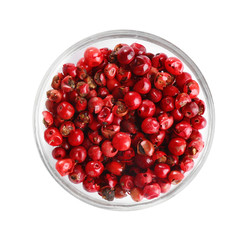 Bowl of red peppercorns isolated on white, top view