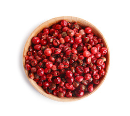 Bowl of red peppercorns isolated on white, top view