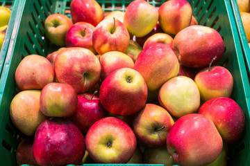 delicious juicy apples on the supermarket counter