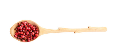 Spoon of red peppercorns isolated on white, top view