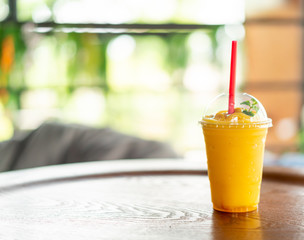 mango smoothies glass in cafe