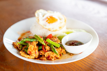 Stir Fried Pork in Red Curry Paste with Rice and Fried Egg