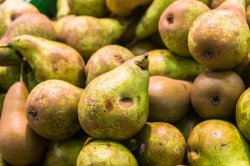 juicy ripe pears on the supermarket counter
