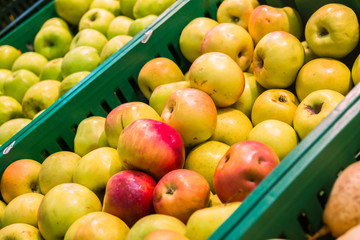 delicious juicy apples on the supermarket counter