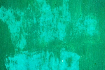 Fototapeta premium Old corroded metal wall background with flaky green paint .Rusty flaky cracked metal surface.Abstract the surface texture of the old metal.