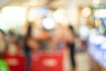 Blur image of Shopping mall or exhibition hall and people for background usage