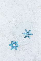 Beautiful wooden snowflakes, patterned frame for Christmas or New Year background or greeting card. Copy space. Top view.