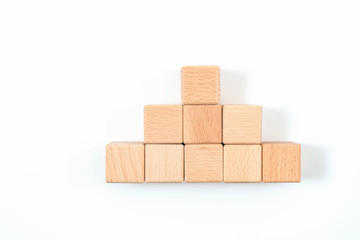 wood cube arrange in pyramid shape ,business concept