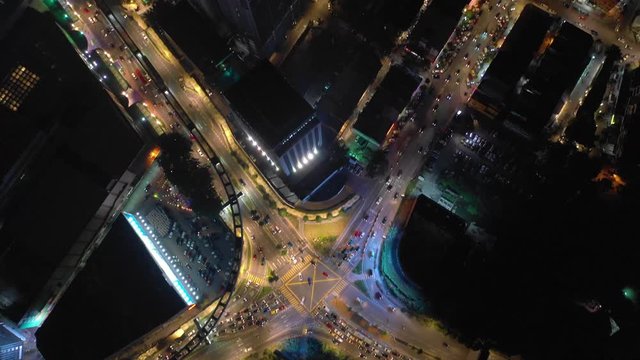 kuala lumpur city downtown night illuminated famous traffic crossroad aerial topdown panorama 4k malaysia