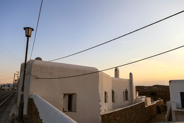 Fototapeta na wymiar A house on the island of Mikonos at sunset.