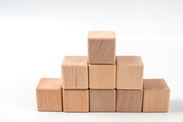 wood cube arrange in pyramid shape ,business concept