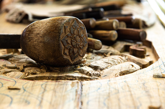 Old wood hammer and various of wood carving tools for skillfull wooden timber carpenter art work background.