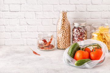 Products in textile bags, glassware. Eco friendly shopping and food storage.