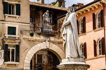 Fototapeta na wymiar Monument of poet Dante Alighieri in the Piazza dei Signori in Verona, Italy
