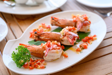 Fototapeta na wymiar Spicy chili grilled prawns in white plate