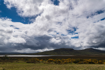 Looking across the wide open expanse and Loch an Rauthair that make up part the flow country of Sutherland, Scotland