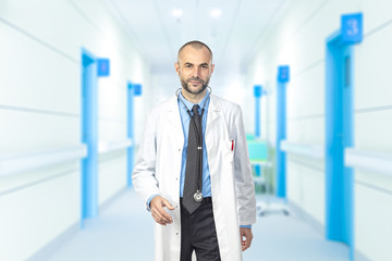 portrait of a man walking aisles of a hospital.