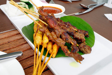 Satay chicken beef with peanut sauce onion ketupat rice cake