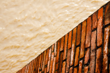 Brick wall for containing a water channel