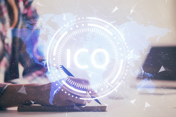 Cryptocurrency hologram over woman's hands writing background. Concept of blockchain. Multi exposure
