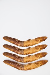 Traditional Balkan baguettes on white background.