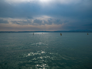 Lake Gardasee Water view during Summer vacation time with a mediterranean feeling