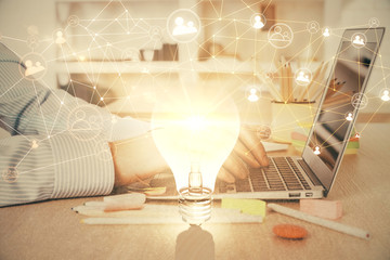 Social network theme hologram with businessman working on computer on background. Concept of world...